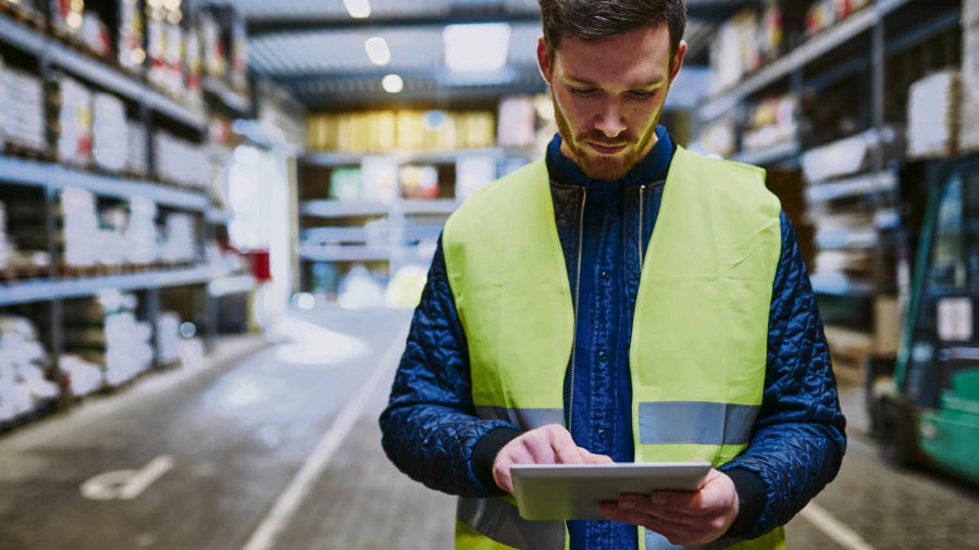 Warehouse employee using a tablet