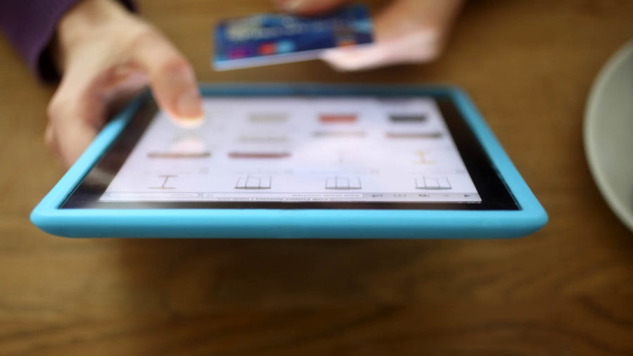 Person using a tablet to buy products online