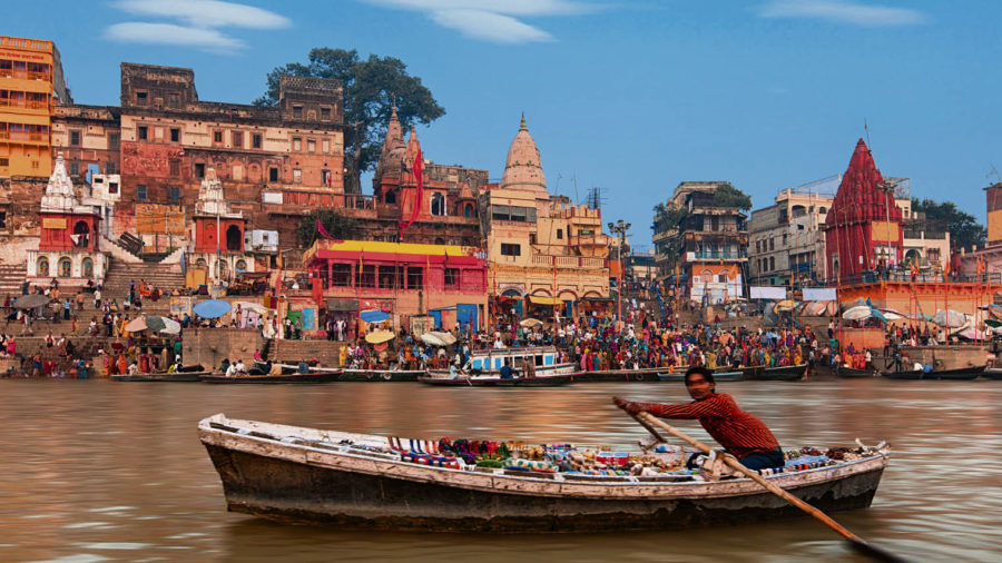 Man in rowing boat on River Ganges