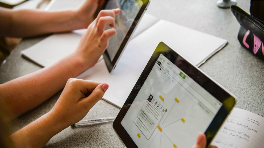 Children on tablets in a classroom