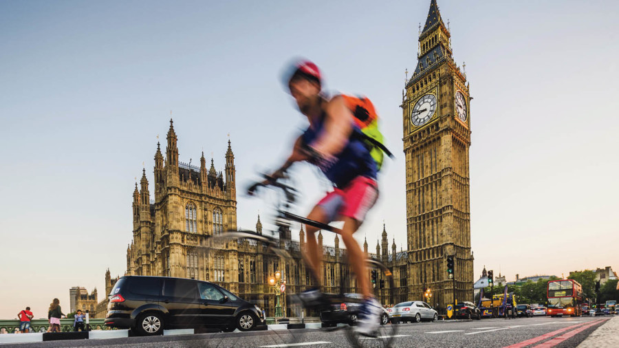 Man on bike outside Parliament