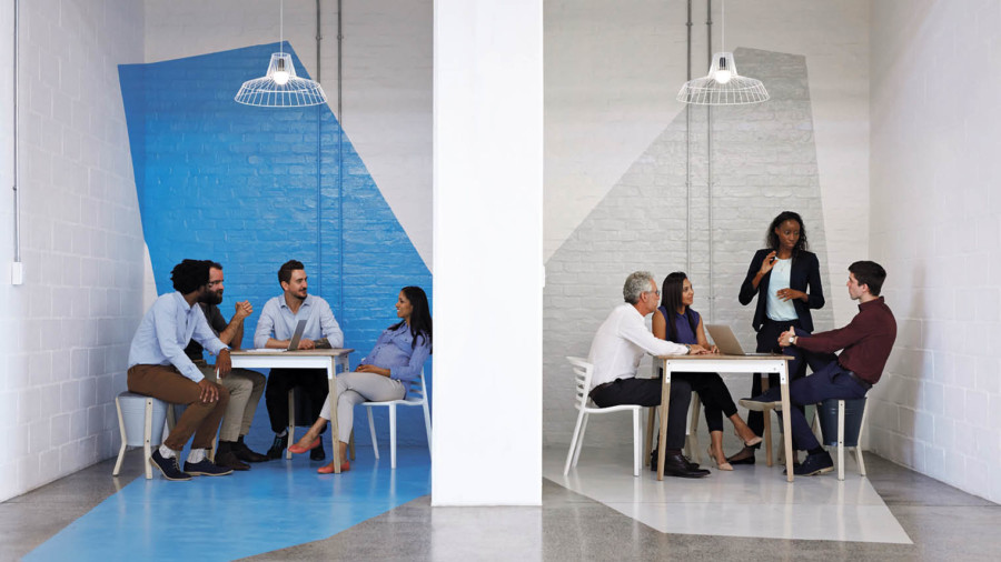 Two groups of employees sitting down