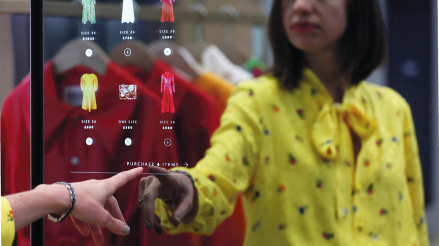 Woman shopping using a touchscreen