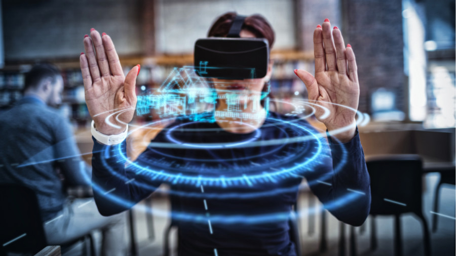 Woman looking at house in virtual reality