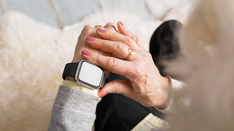 Elderly woman using Apple Watch