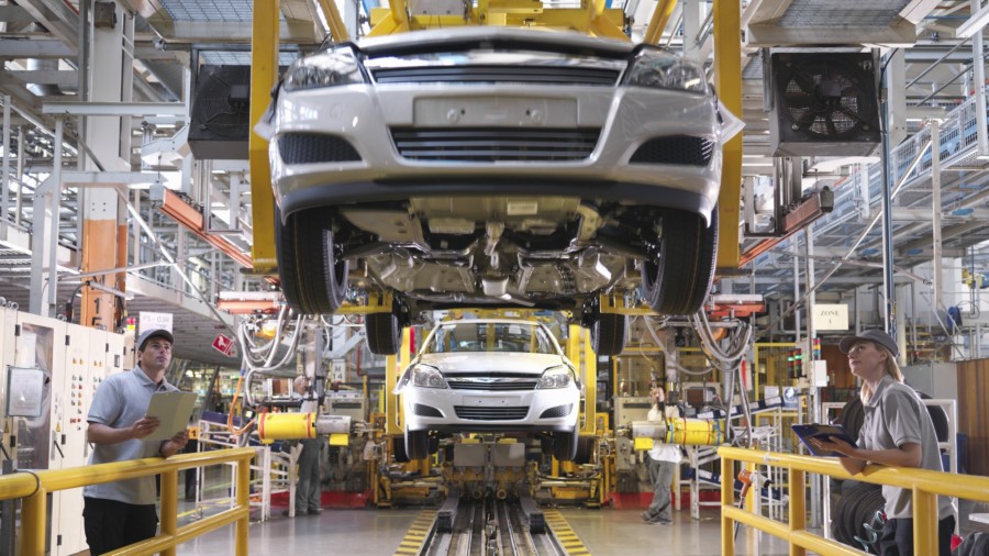 Car Workers Inspecting Production Line