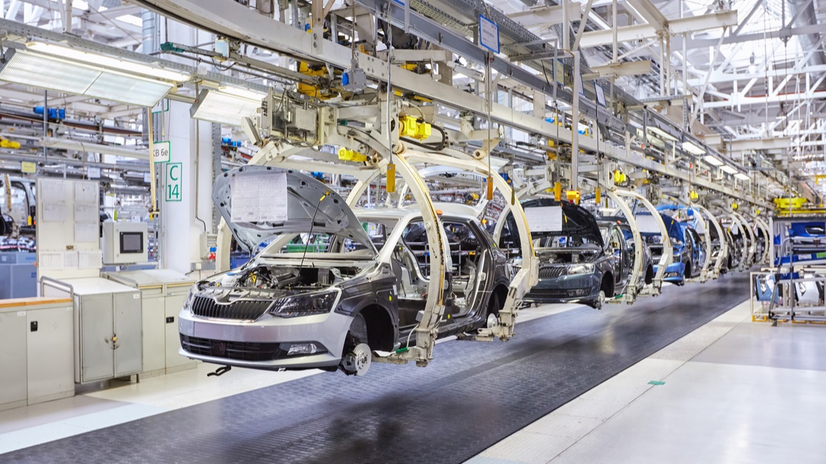 Cars being worked on in a factory